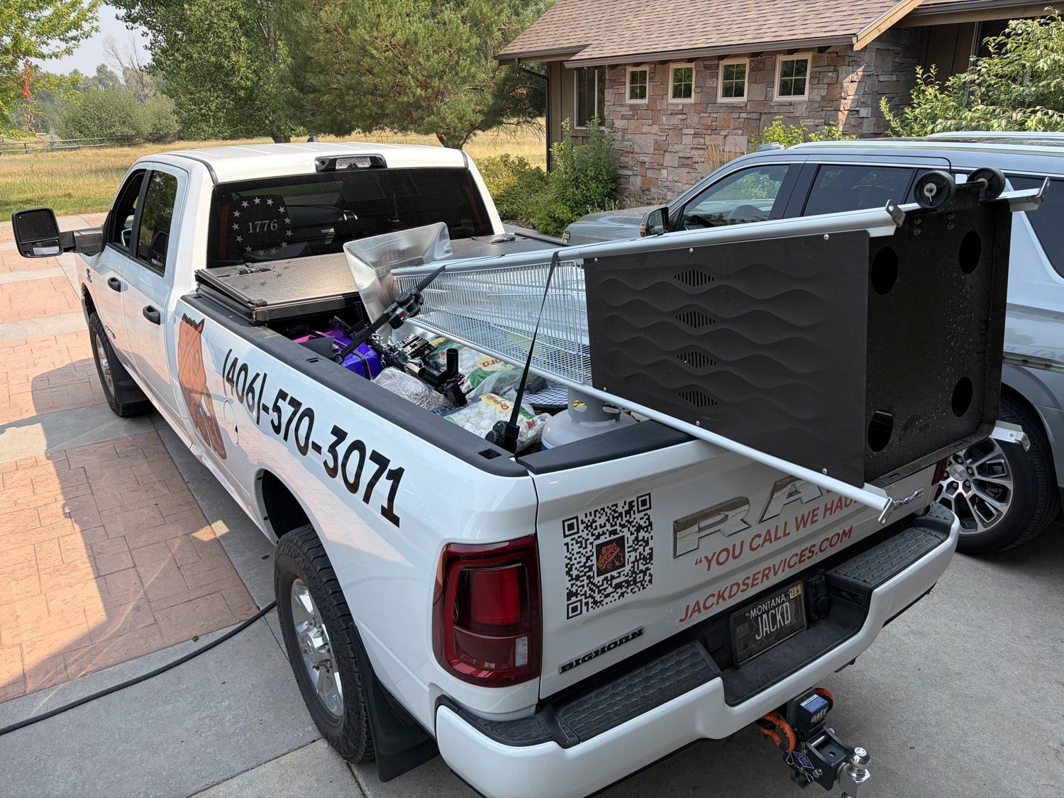 Large metal smoker loaded in the JACKD truck bed