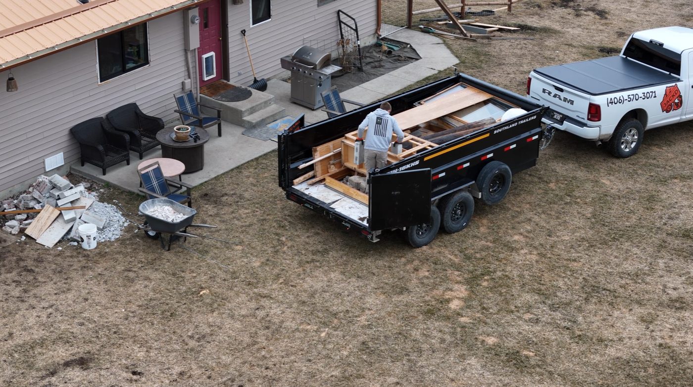 Loading concrete blocks into a dump trailer