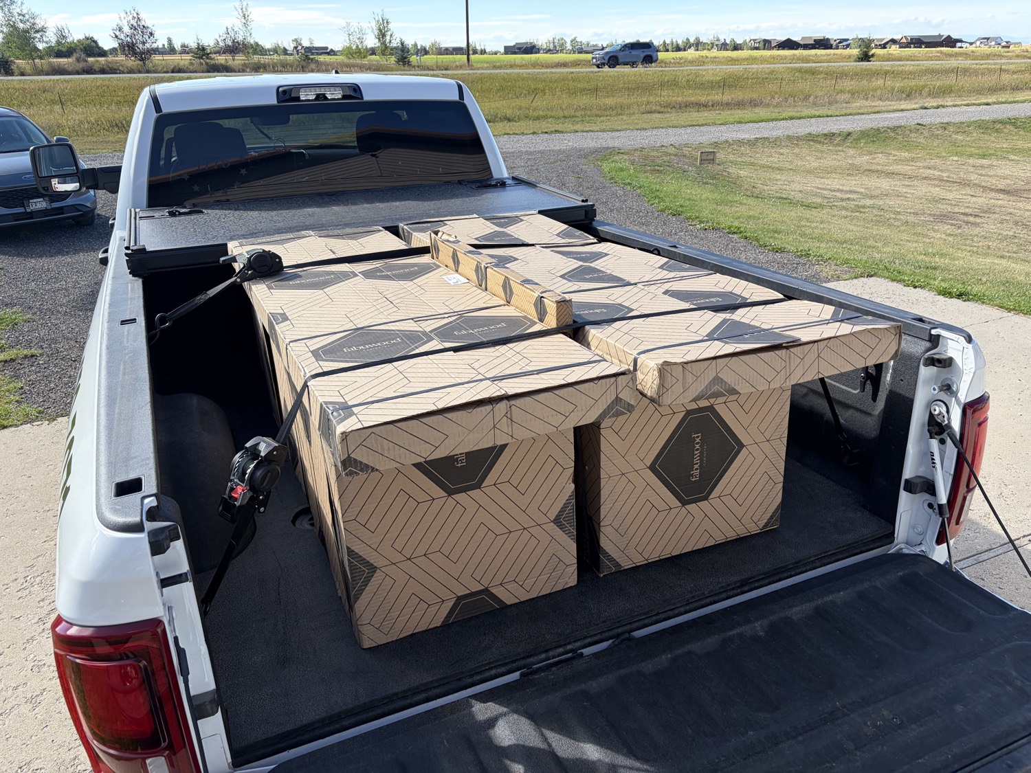 Fabuwood cabinet boxes strapped in the JACKD truck bed